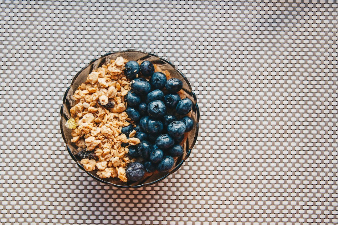 Bowl of oats topped with fresh blueberries