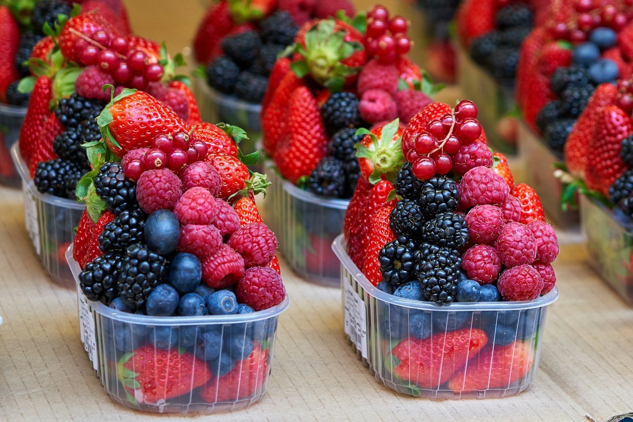 Fresh mixed berries displayed at a market
