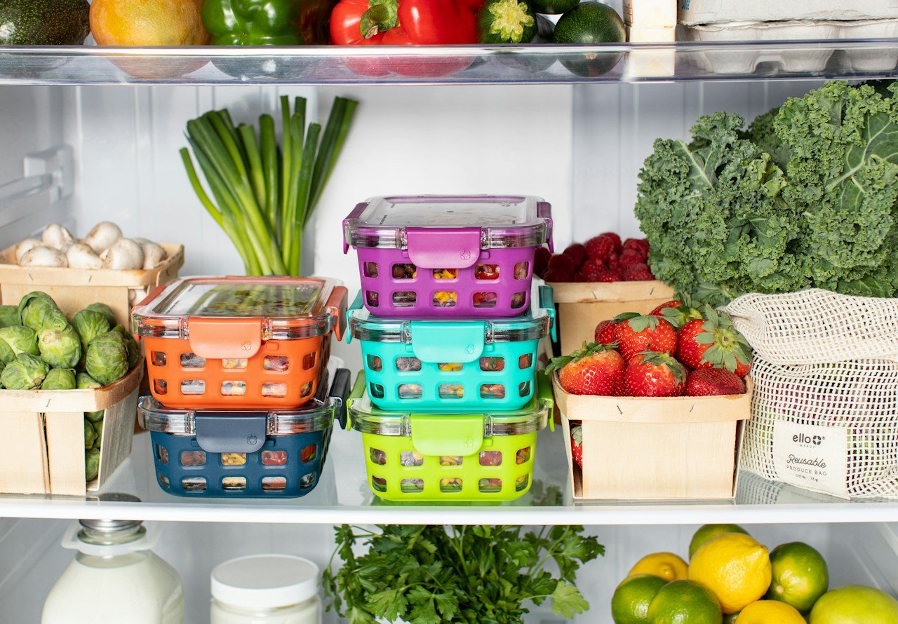 Fresh produce stored in containers inside a refrigerator