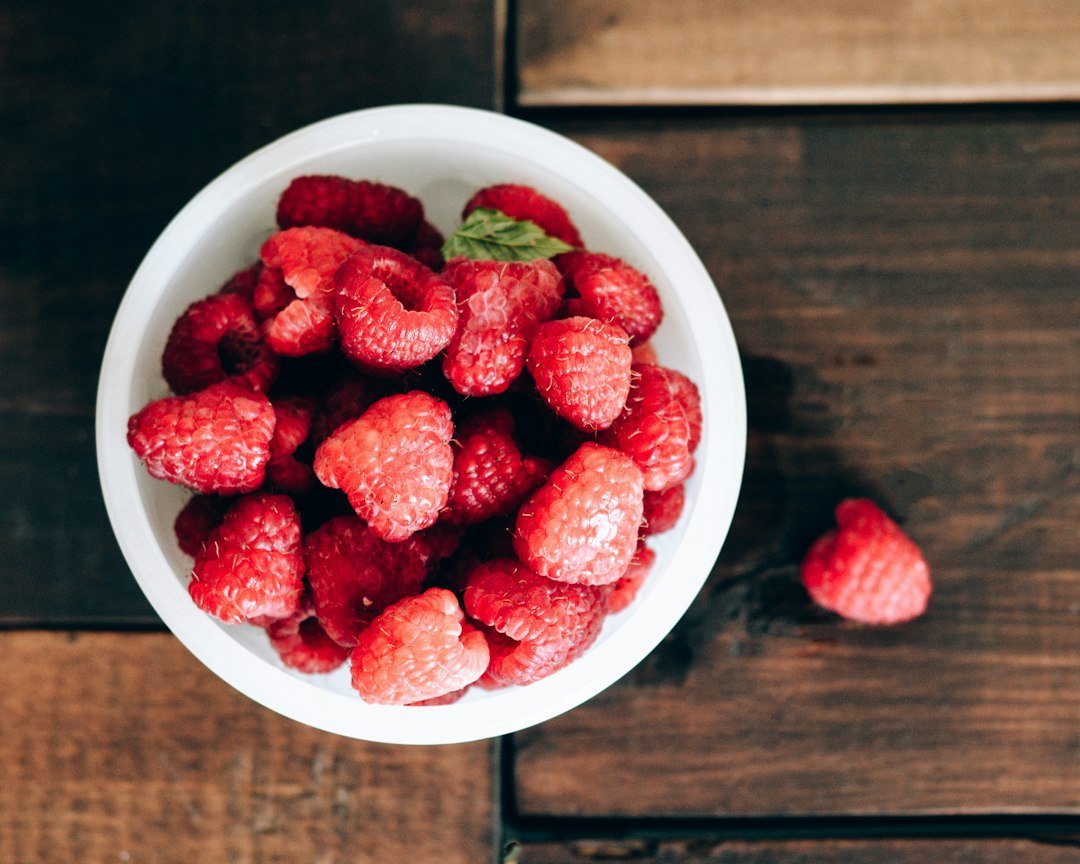 Fresh raspberries gathered in a bowl