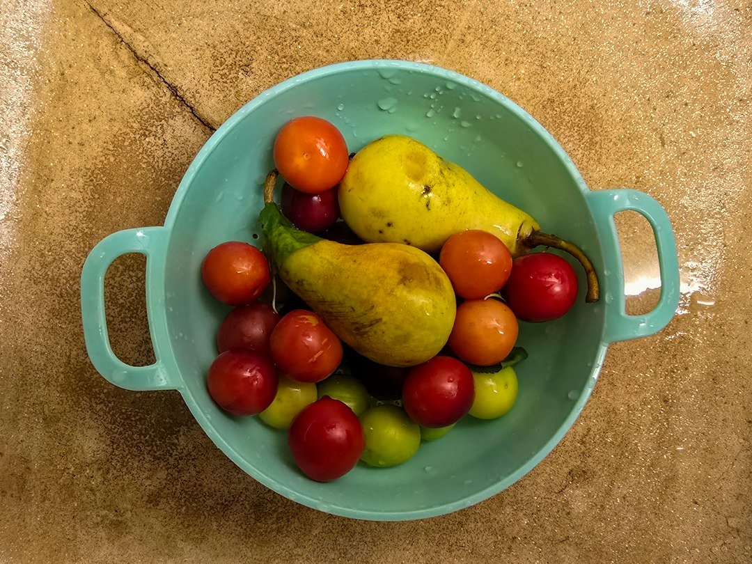 Fresh fruit in a colander ready for rinsing